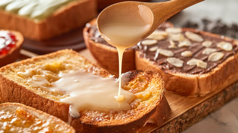 Drizzling condensed milk on toast